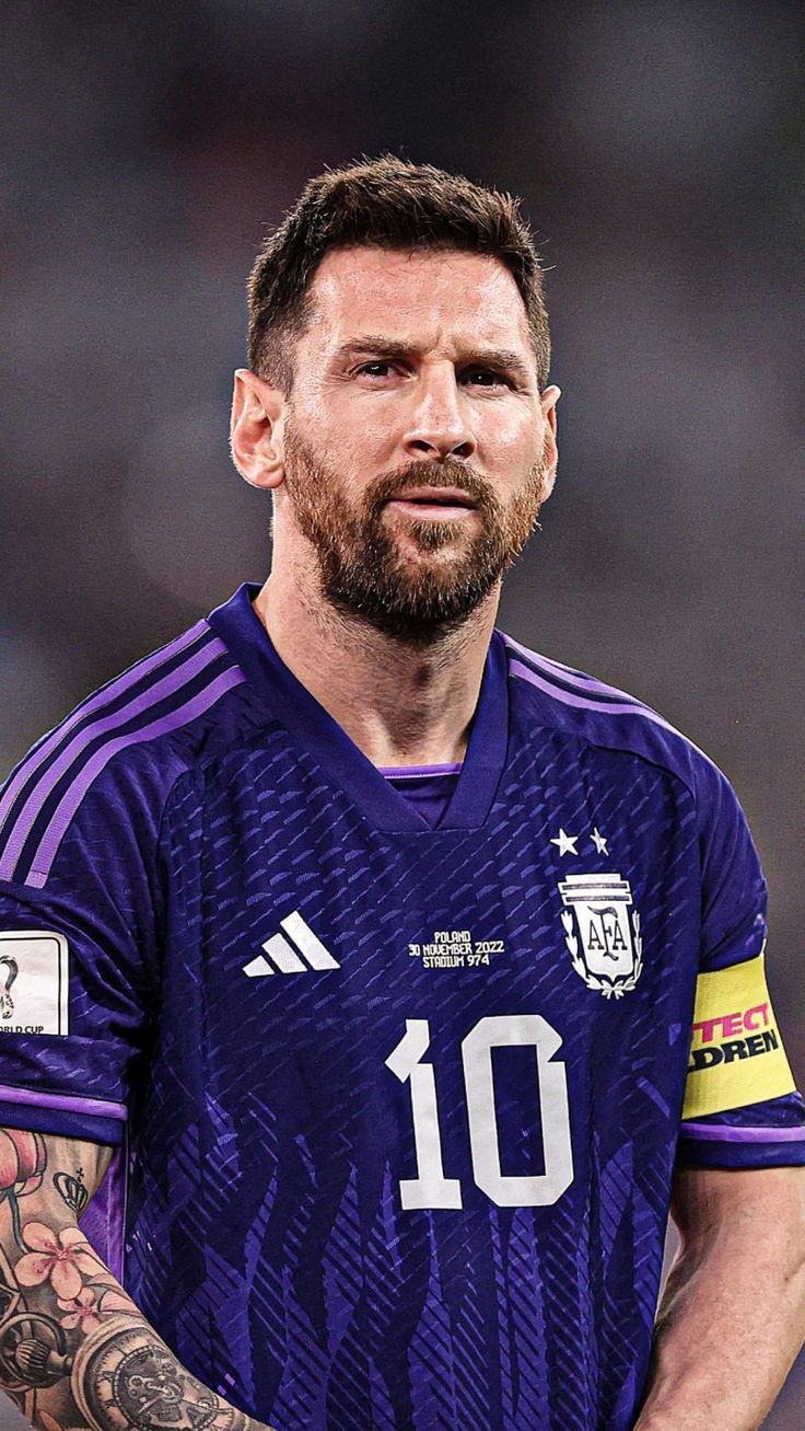 Messi wearing new Argentinian jersey.