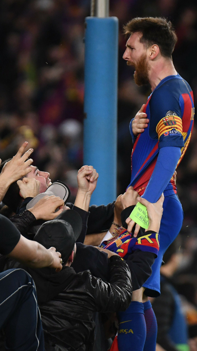 Messi celebrating with fans after scoring a goal.