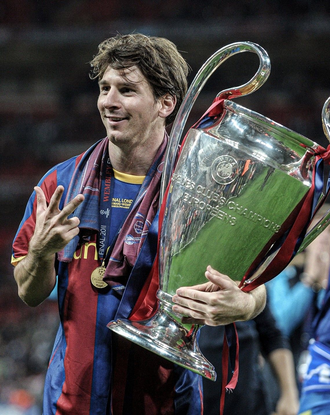 Messi with Champion's League Trophy.